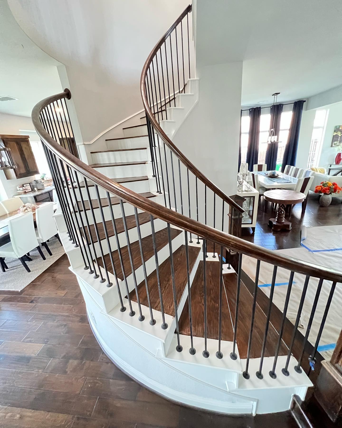 Rustic luxury vinyl plank flooring in a bright breakfast nook with built-in bench seating