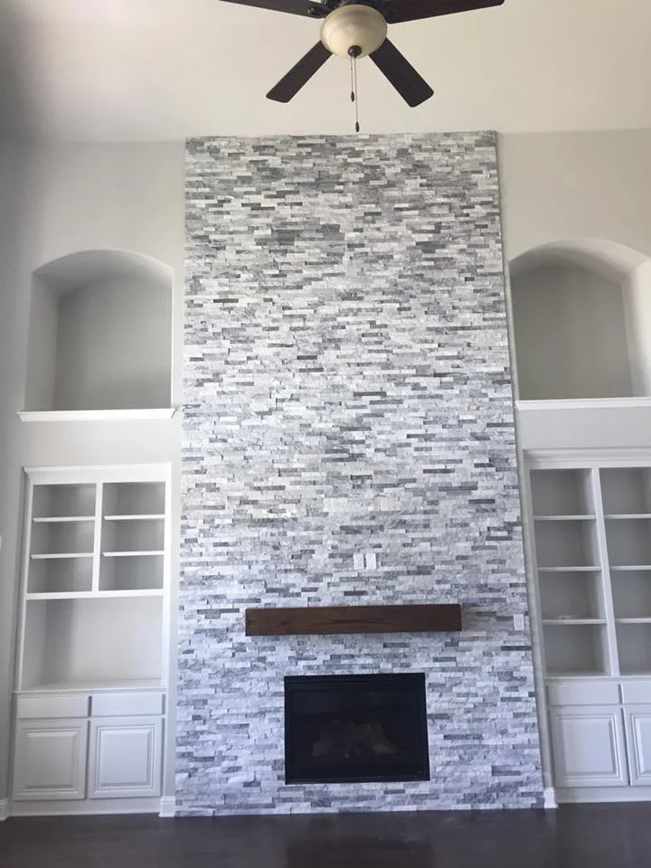 Open living space with rich dark hardwood flooring and modern pendant lighting